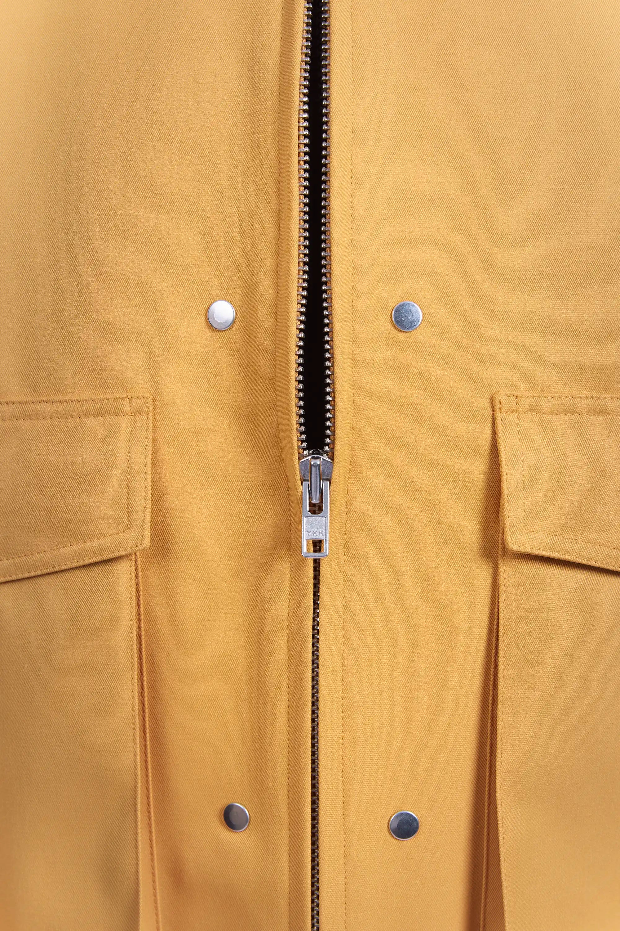 Detail view of YKK size 8 metal zipper half open