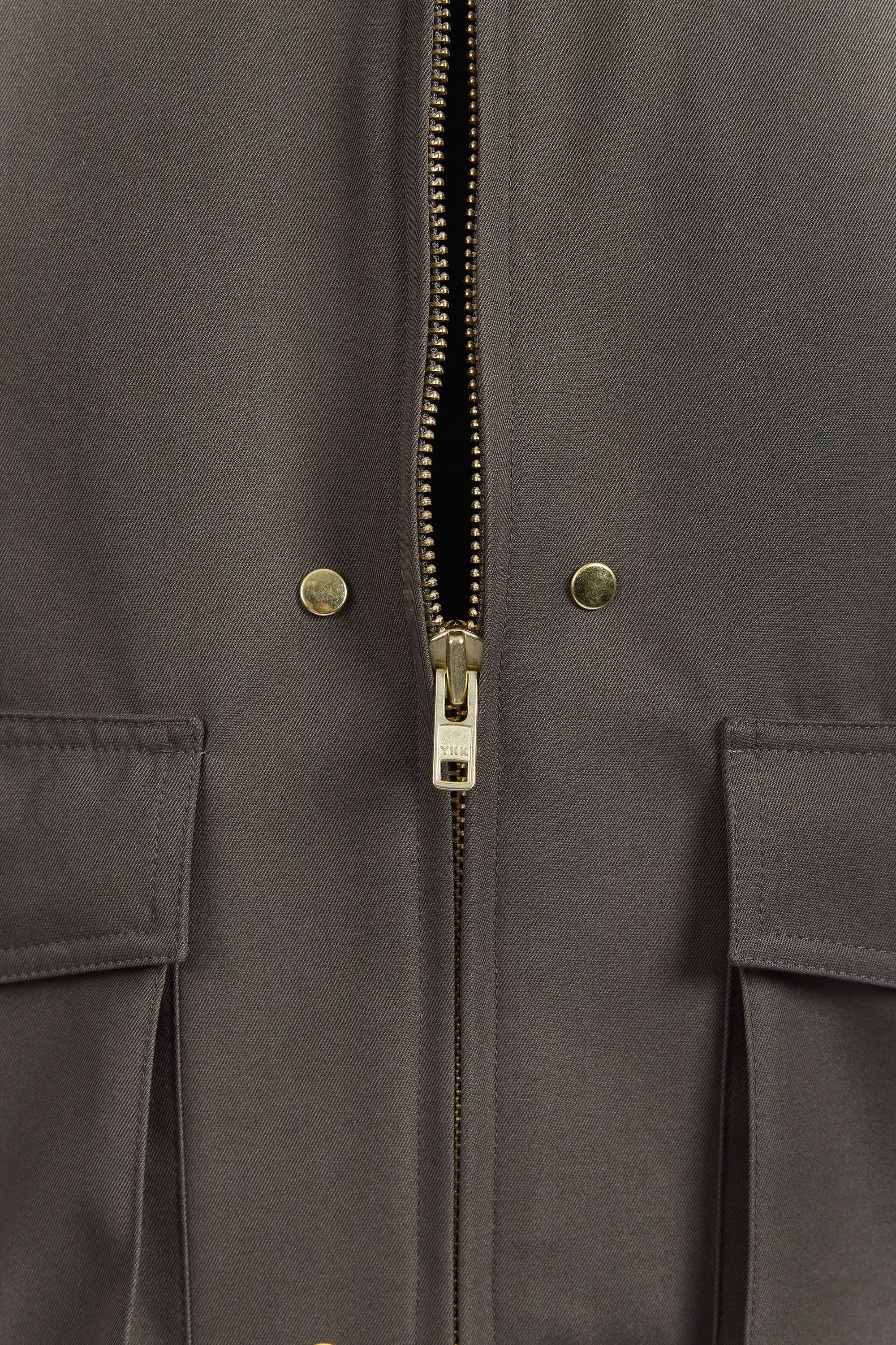 Detail view of YKK metal zipper half open